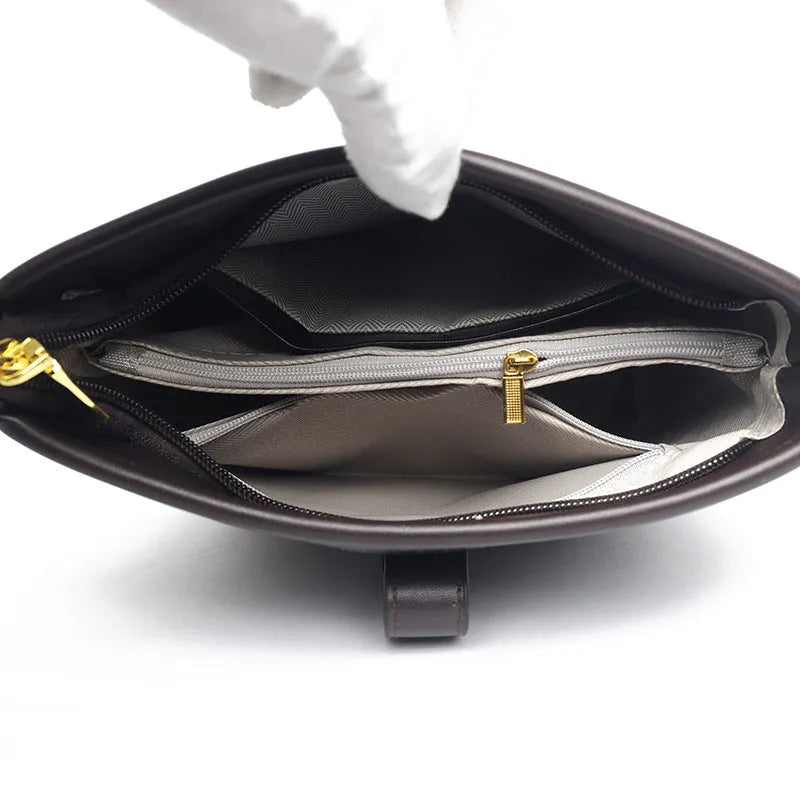 Korean-style black bucket messenger bag with double shoulder straps showing internal organiser compartments