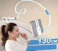 Blue universal mobile phone and tablet holder with 120cm pole on a bedside table