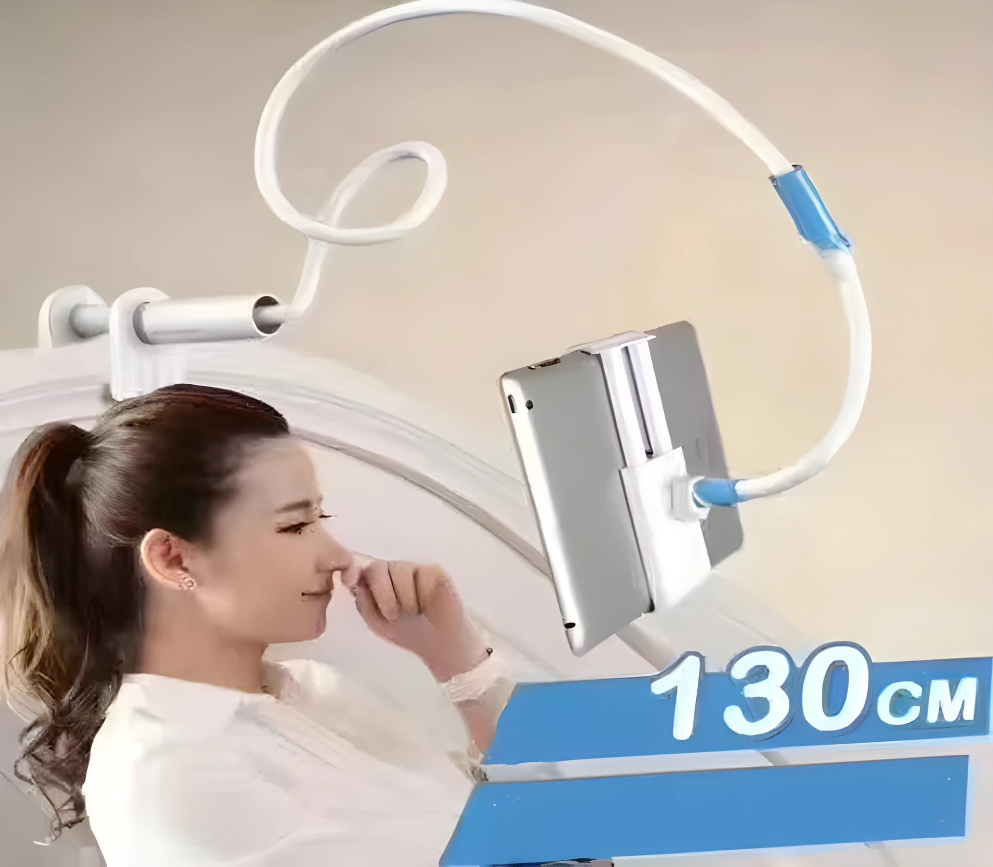 Blue universal mobile phone and tablet holder with 120cm pole on a bedside table
