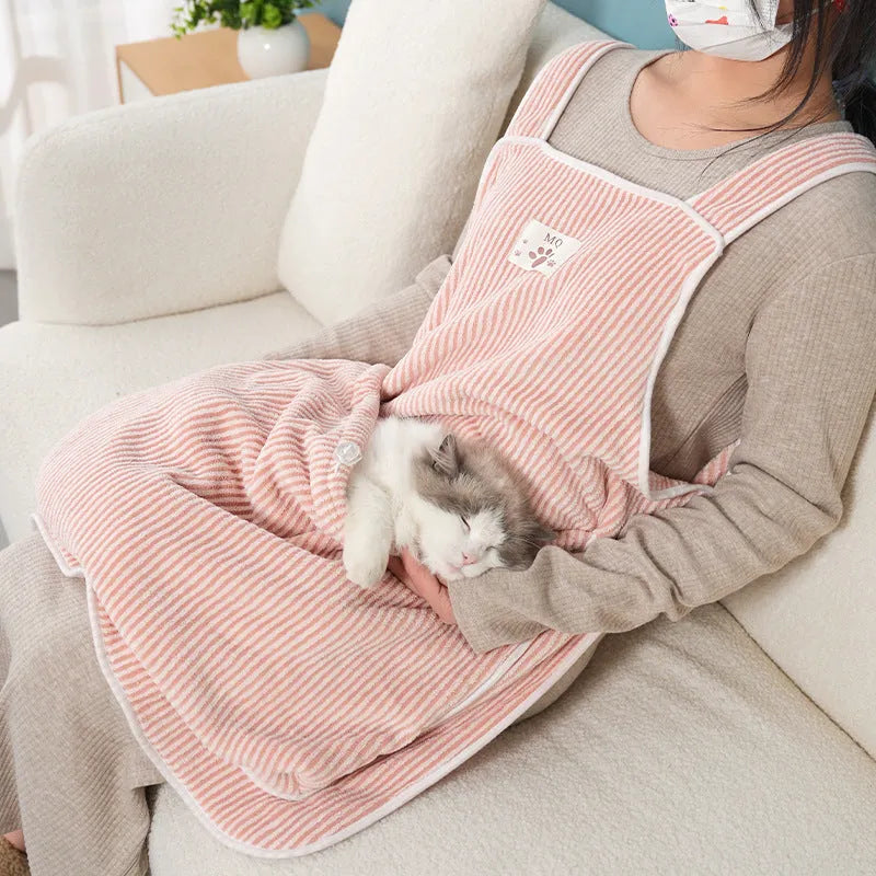 Cloth cat petting apron in a striped pattern, shown worn by a person holding a cat.
