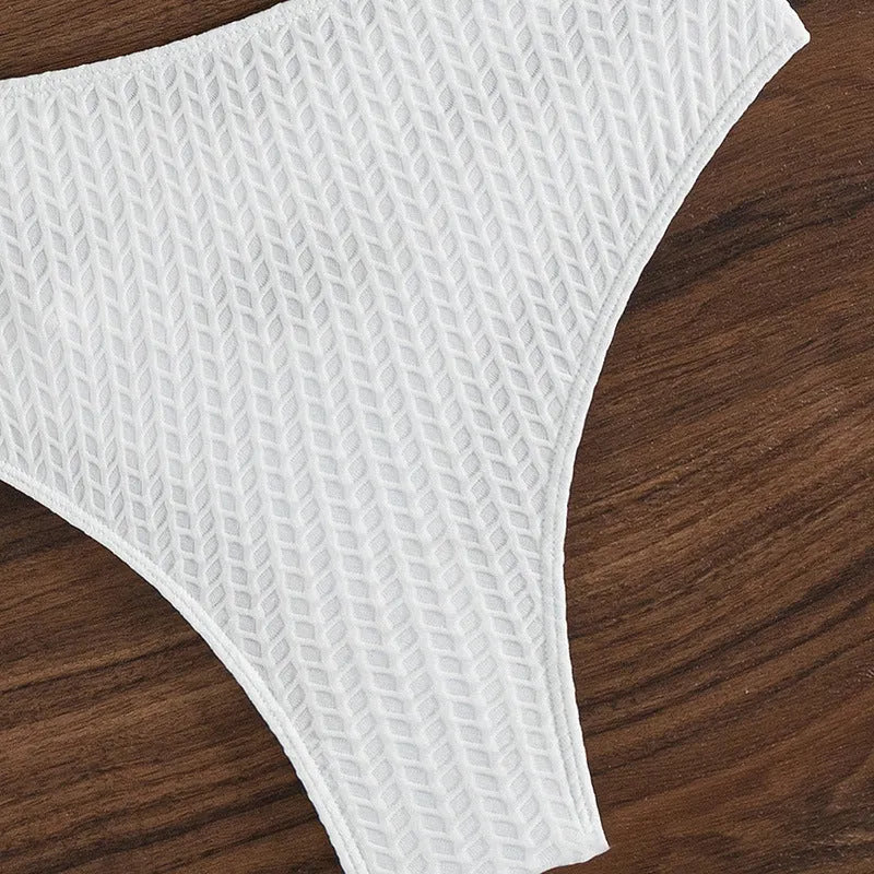 White solid colour backless bikini swimsuit for women on beach