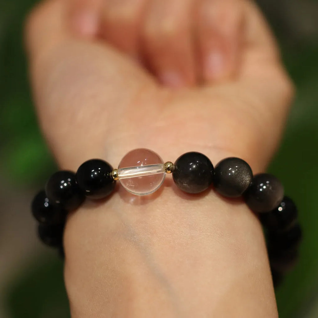 White and pink cat eye obsidian crystal bracelet with geometric Chinese patterns