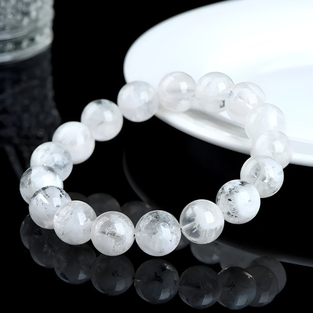 Women's bracelet with round blizzard snowflake crystal beads in geometric shapes on a wrist.