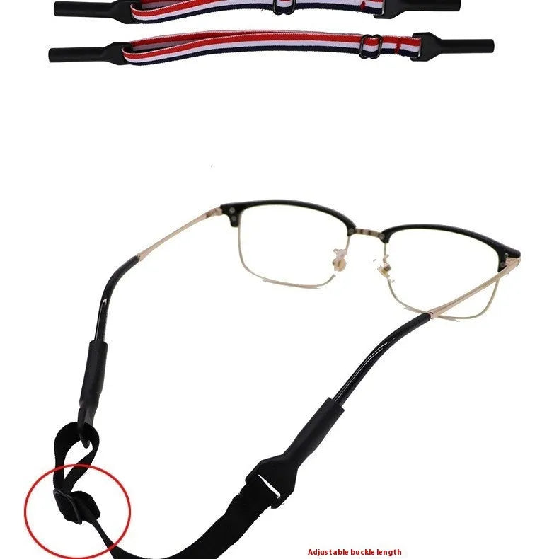 Black adjustable glasses cord strap with silicone ends shown on a pair of spectacles.