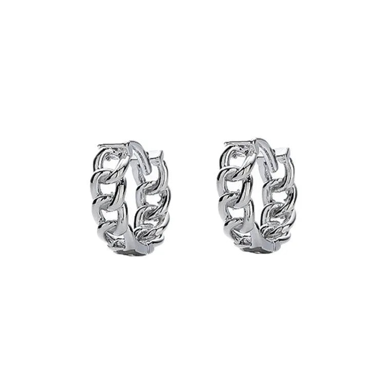 West Coast men's geometric copper earring studs on a plain background, showing silver and patterned options.