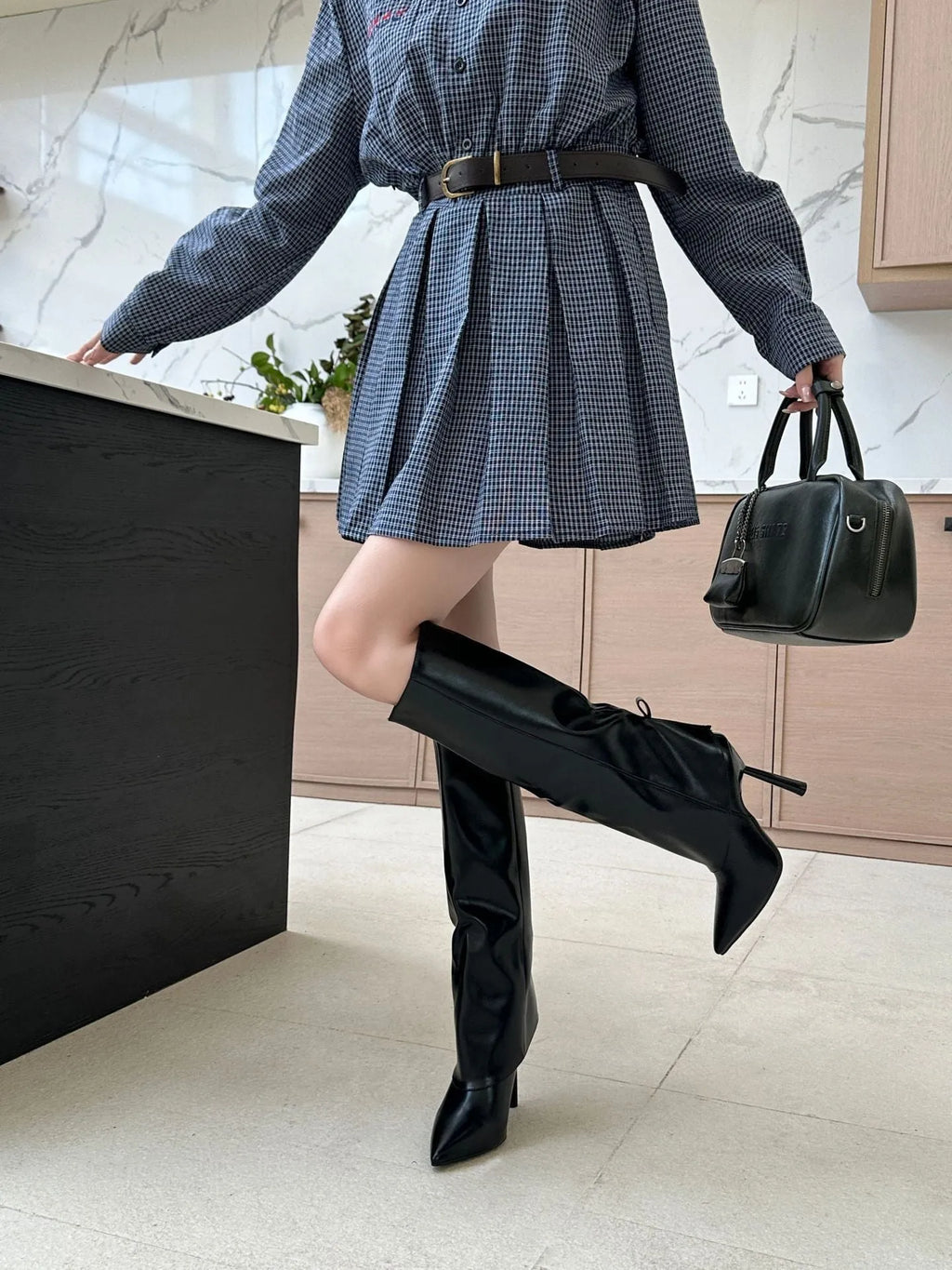 Black slim leg warmer boot covers with high-heel cut-out showing stiletto heel