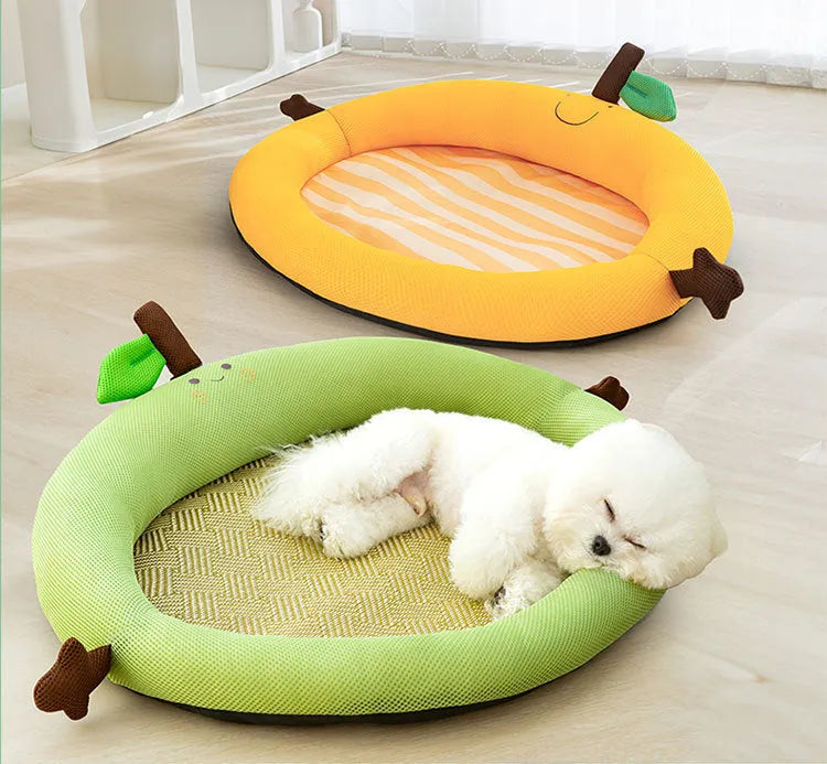 Green pet cooling mat with a raised fruit-shaped backrest, sized for a large dog.
