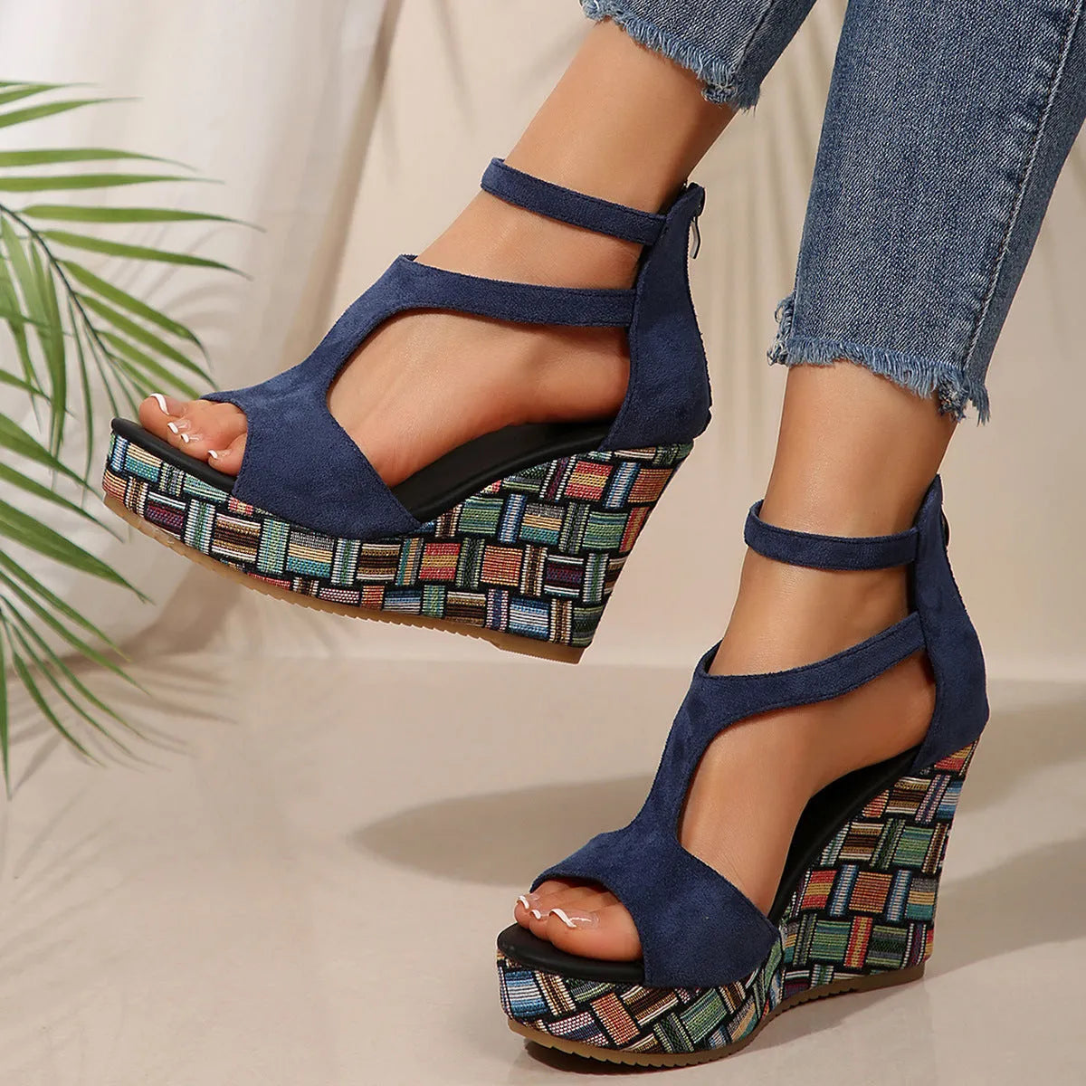 Women's beige ankle-strap sandals with a buckle and thick, textured rubber soles on a plain background.
