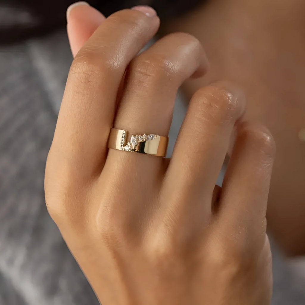 Gold electroplated women's ring with shining zircon stone on a copper band.