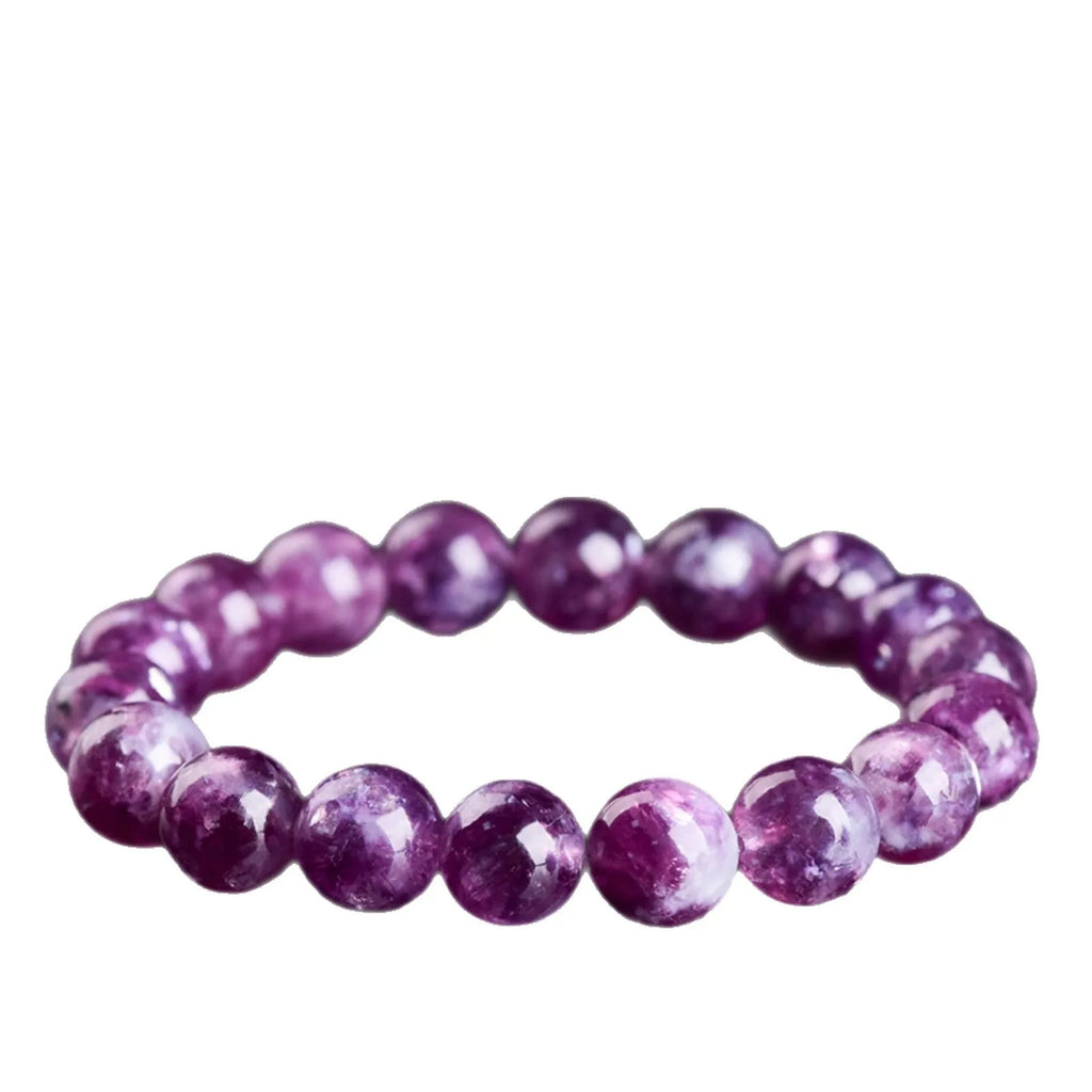 Grandmother crystal bracelet with polished purple geometry beads on a white background.