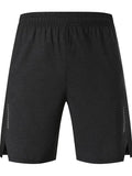 Man wearing forest green five-point single layer spandex casual shorts, showing mid-waist and shorts length fit.