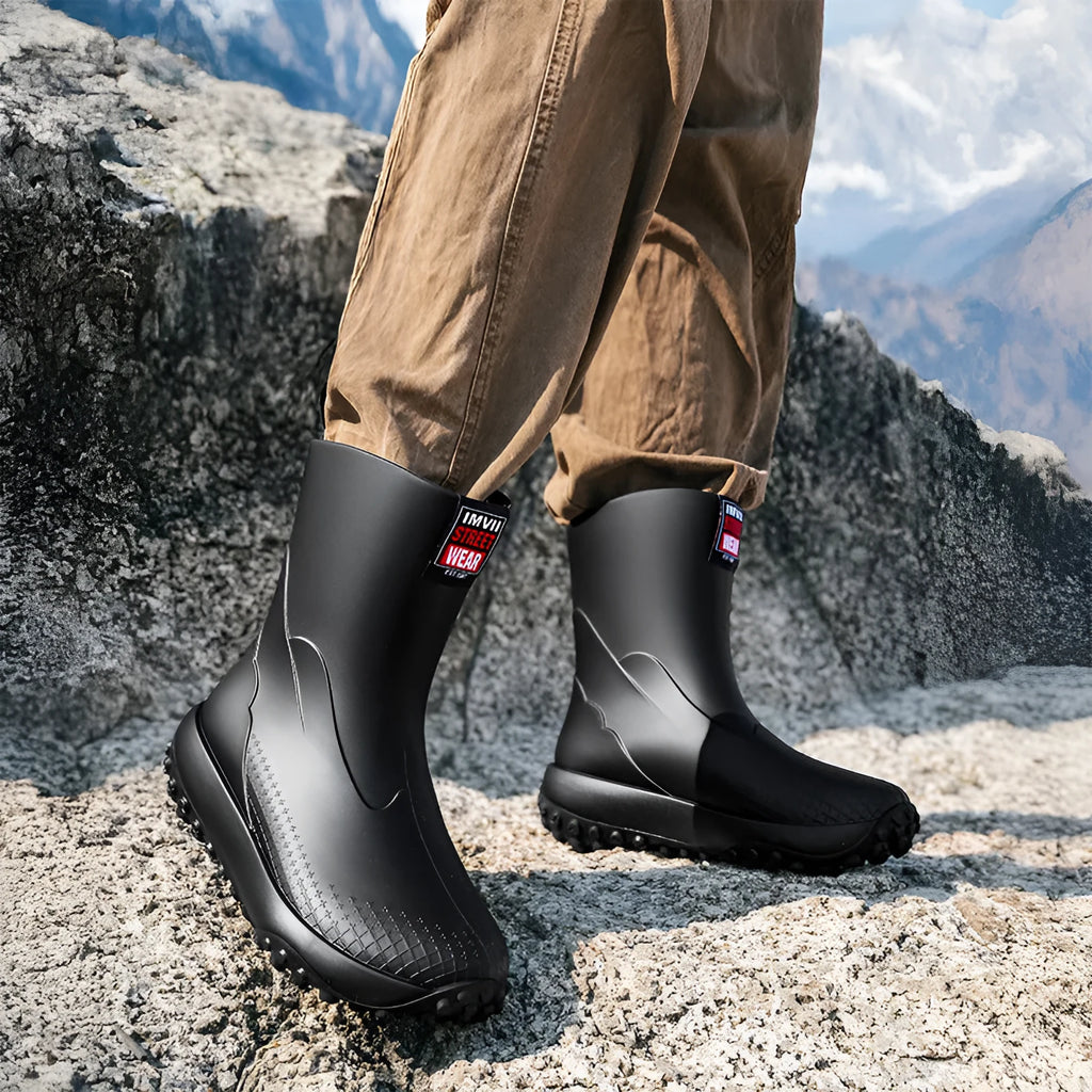 Men's PVC oversleeve rain boots in beige with a non-slip plastic sole.