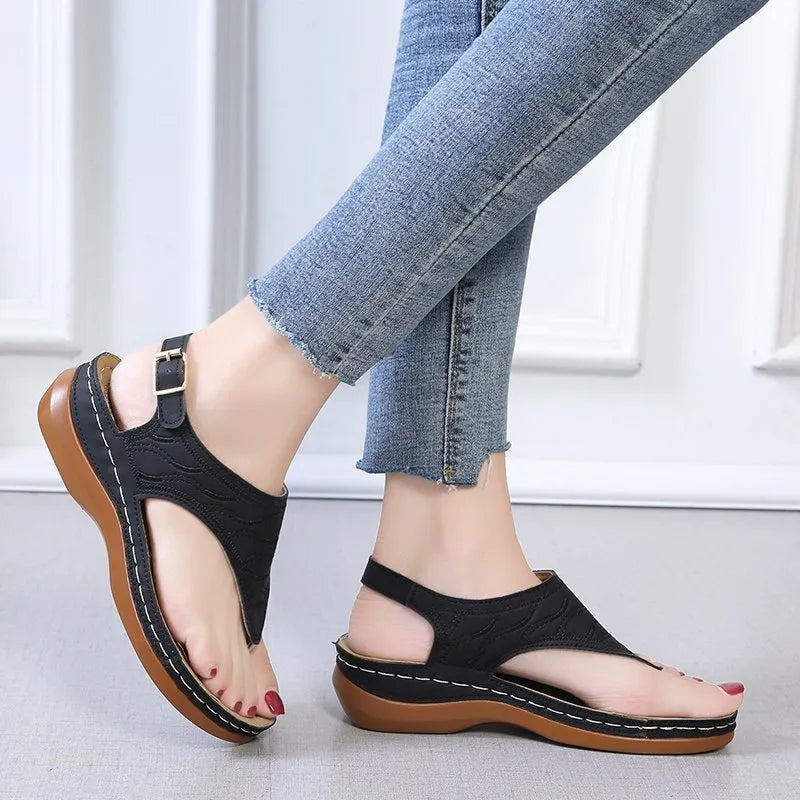 Women's wedge heel casual sandals in red with an adjustable back strap and flip-flop style.