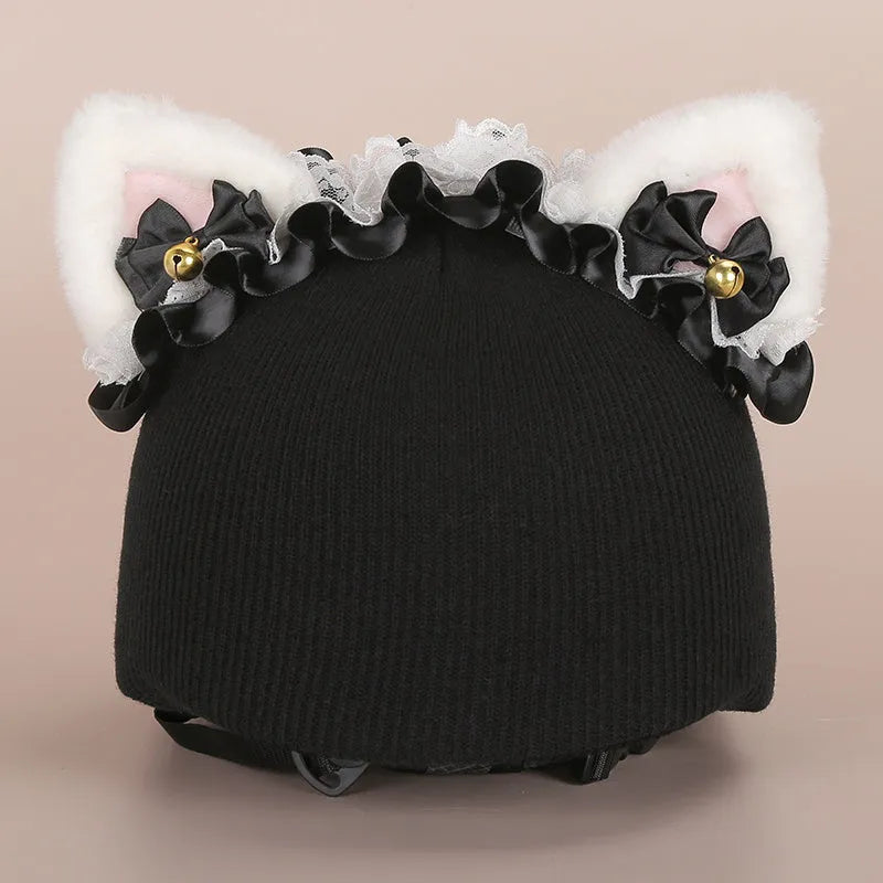 Soft plush cartoon character cover stretched over a pair of black on-ear headphones.