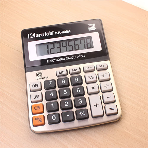 Compact aluminium desktop calculator in silver-grey finish, approximately 14.5cm long, for basic office calculations