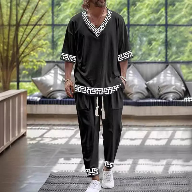 Lightweight cropped sleeve V-neck top and matching trousers suit in a solid colour.