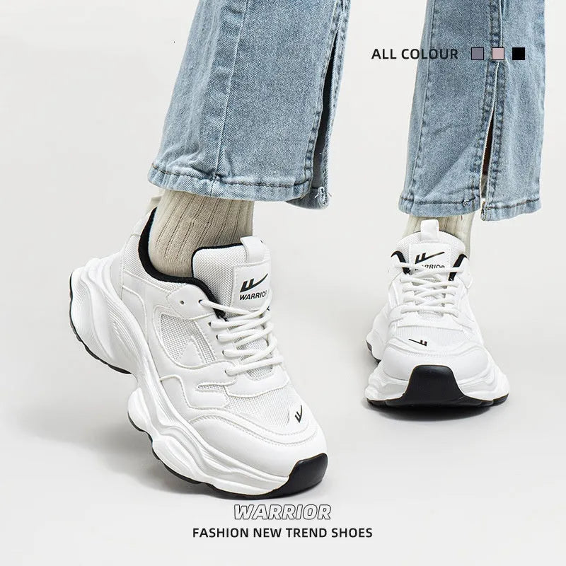 Women's breathable mesh white sneakers with flat heel, round toe, and lace-up closure
