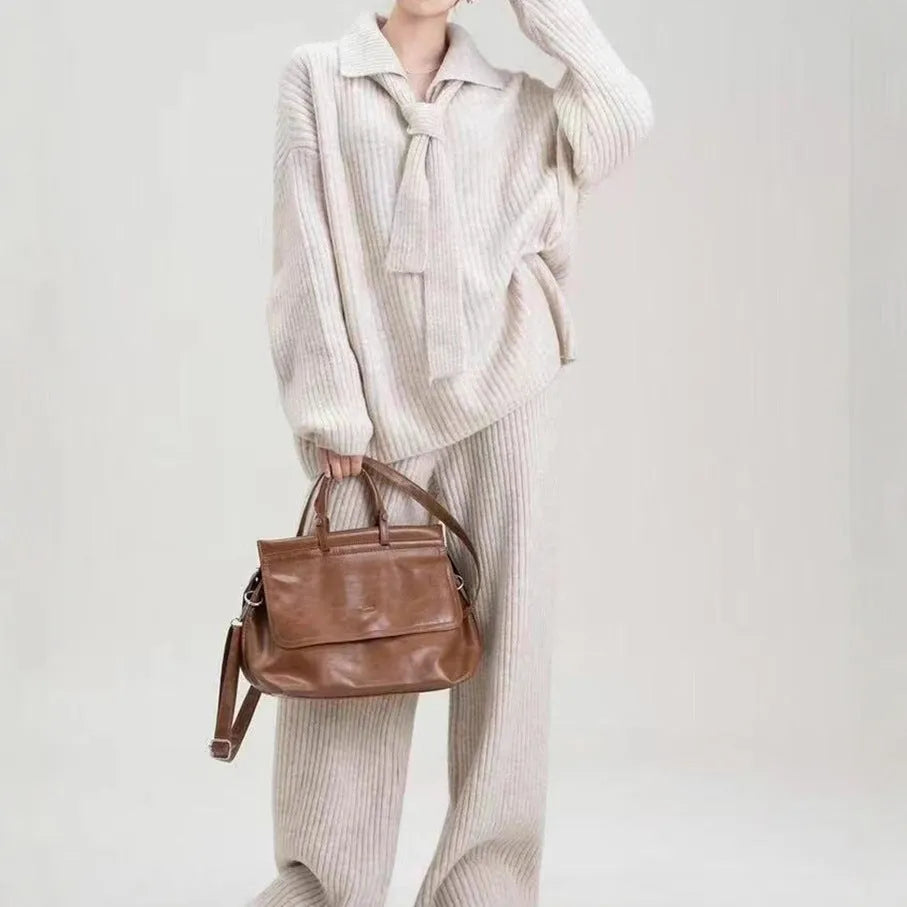 Women's beige knit two-piece set with long-sleeve top and trousers featuring collage stitch detail