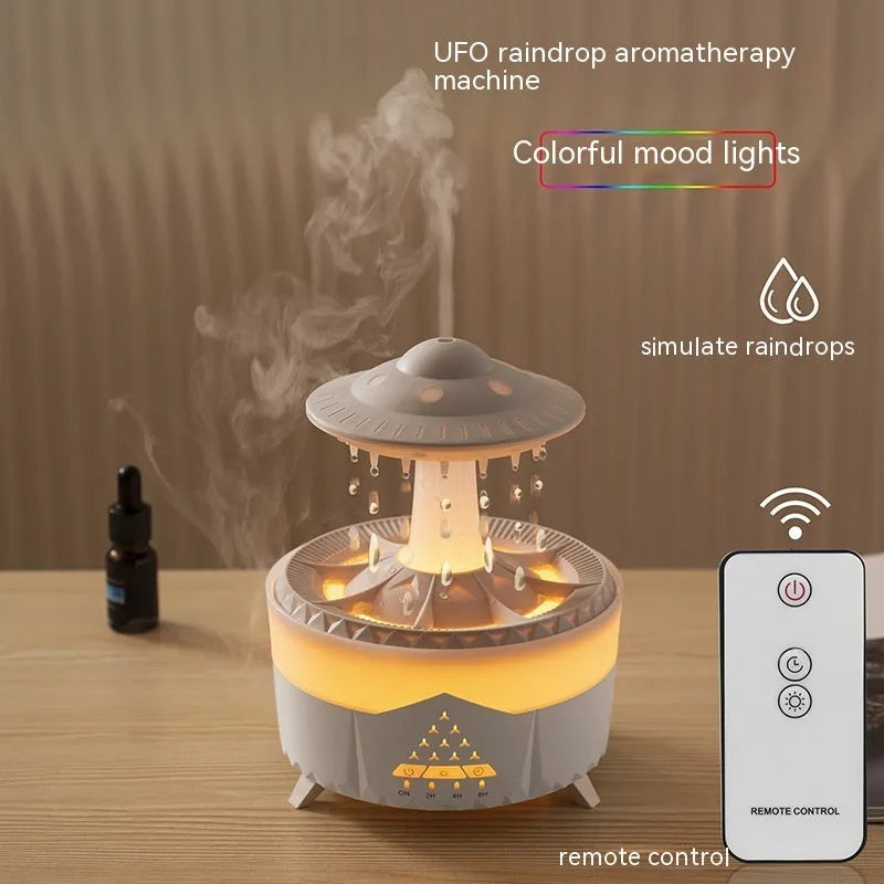 White UFO-shaped cloud humidifier with mist and soft blue night light on a wooden table