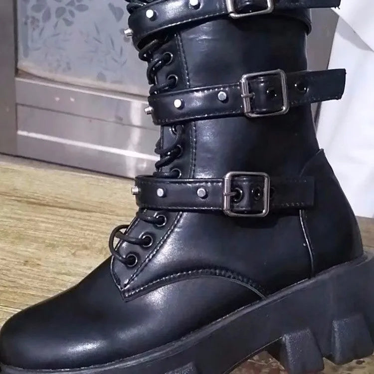Black women's mid-calf boots with metal buckles and a side zipper on a white background.