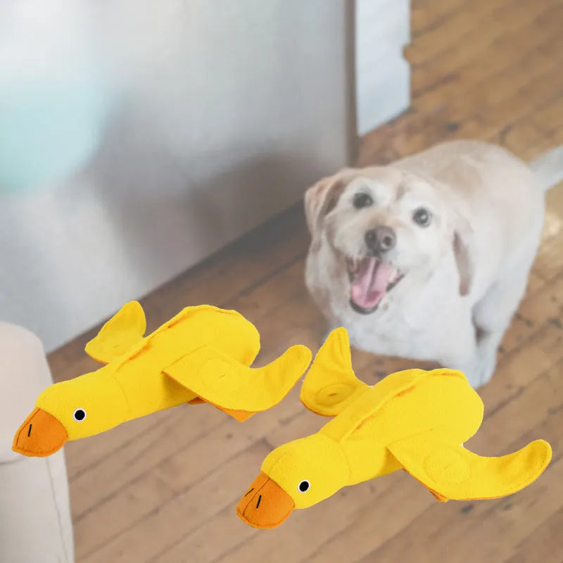 Yellow duck plush dog toy with squeaker and treat dispensing features