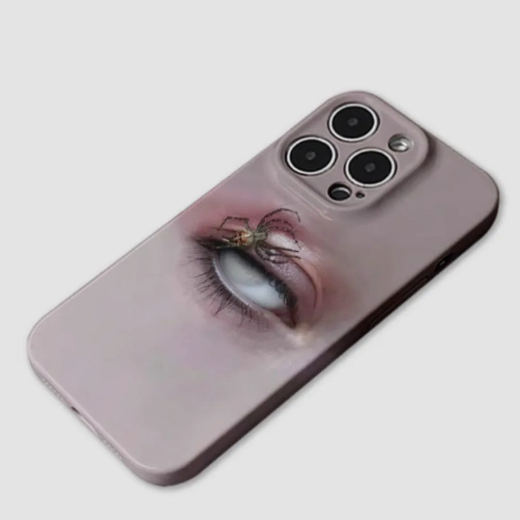 Dark frosted iPhone case with a spider web pattern, shown protecting a mobile phone.