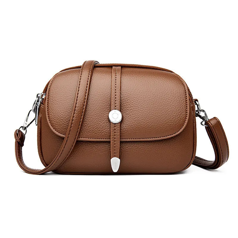 Women's soft PU leather crossbody shoulder bag oval shape in black khaki dark brown colours