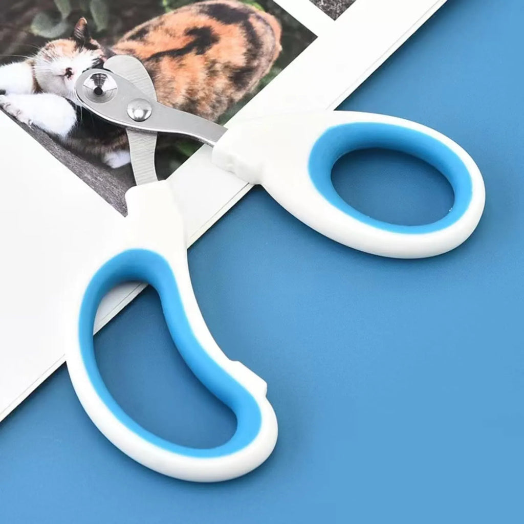 Blue pet nail clippers with a circular safety hole and non-slip handle on a white background.
