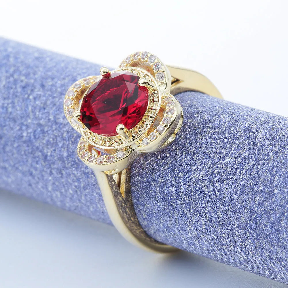 Copper ring with a fruit-shaped setting holding a zircon stone.