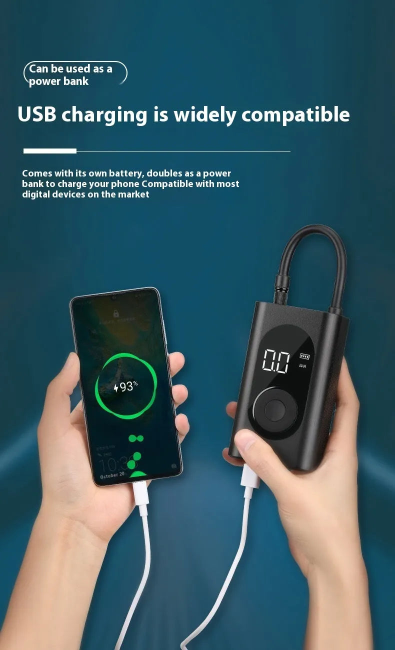 Black portable wireless tyre pump with digital display, LED flashlight, and USB cable on a grey background.
