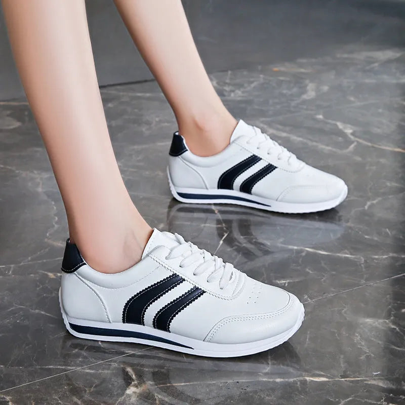Blue casual lace up soft bottom sneaker with rubber sole and round toe, low top design