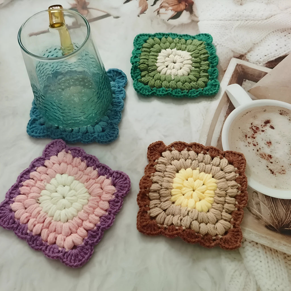 Crocheted wool insulated cup placemat with grandmother lattice pattern in choice of colours