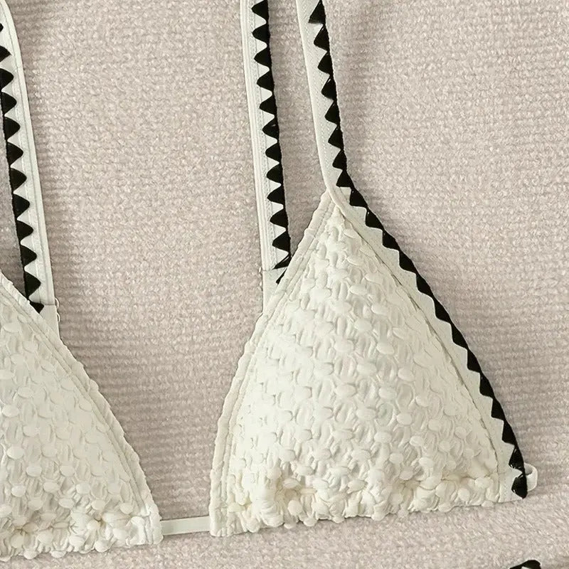 Women's white and blue split bikini swimsuit set with polyester fabric