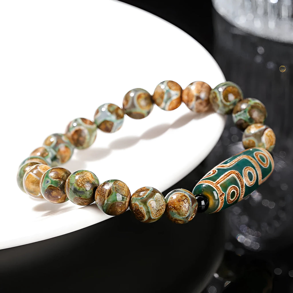 Green Dzi bead barrel shaped bracelet with 8mm handmade beads and Tibetan-inspired design