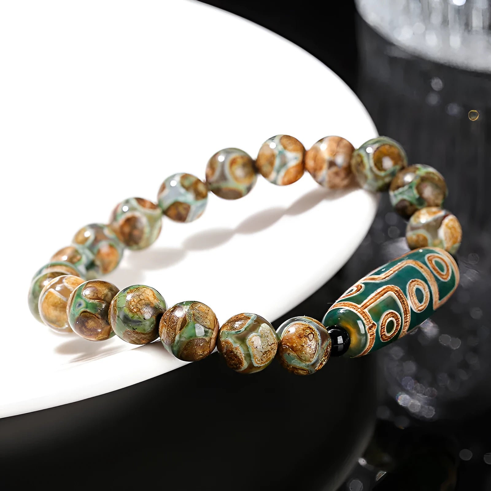 Green Dzi bead barrel shaped bracelet with 8mm handmade beads and Tibetan-inspired design