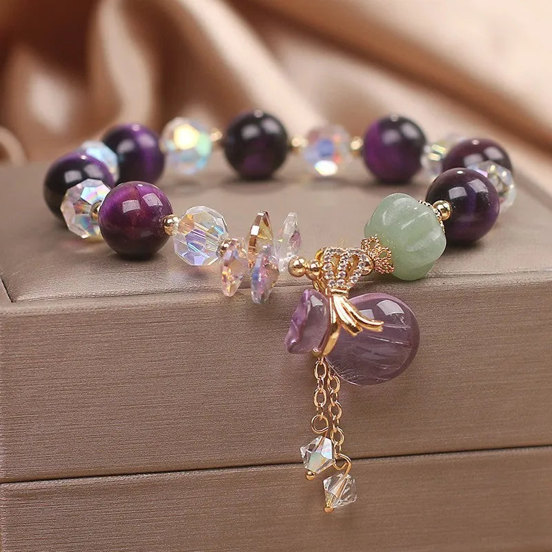 Women's purple tigereye crystal bracelet with money bag pendant and rhinestone decoration in forest style design