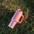 Large stainless steel vacuum insulation cup showing rainbow colour options and gradient designs