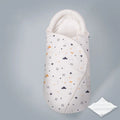 Cotton baby anti startle swaddle measuring 30 by 60 centimetres in a colourful print design.