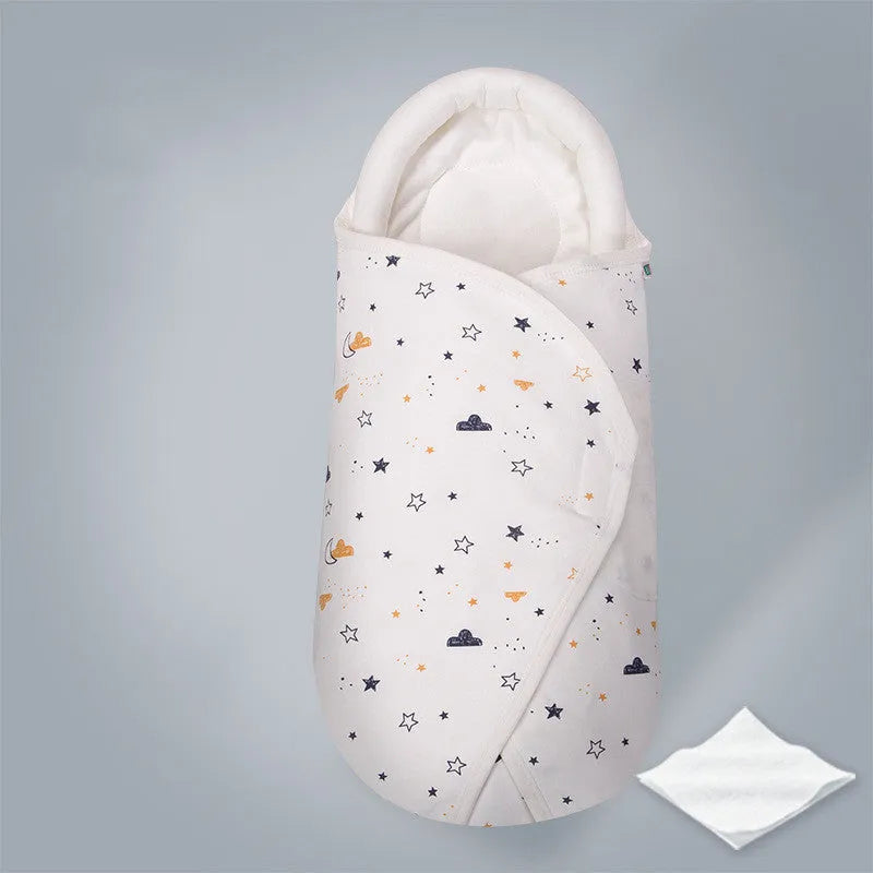Cotton baby anti startle swaddle measuring 30 by 60 centimetres in a colourful print design.