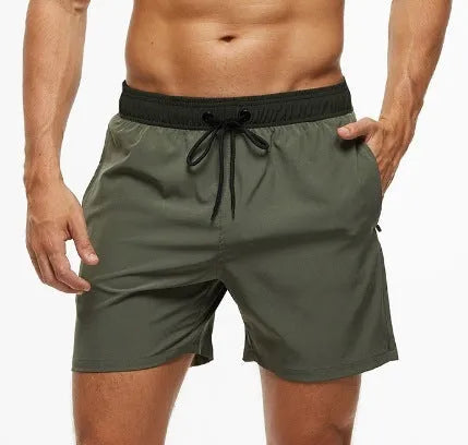 Men's blue athletic shorts with a drawstring waist and a visible zippered pocket on the hip.