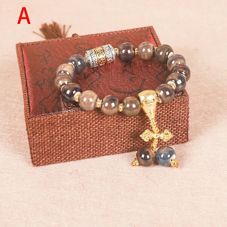 Men's gradient ceramic Yonghe blessing bracelet with coloured glaze beads on a wrist.