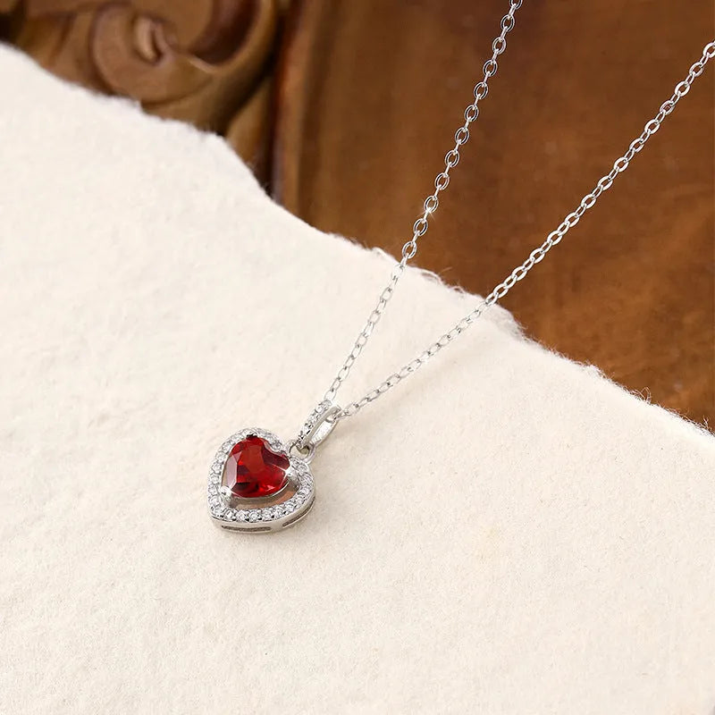 S925 sterling silver heart necklace with a natural gemstone on an adjustable cross chain for women.