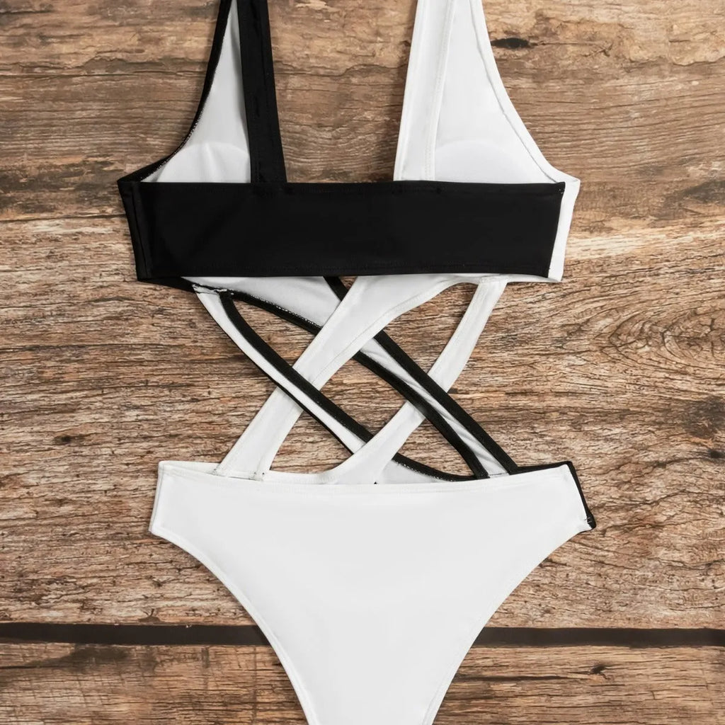 White women's one-piece swimsuit with colour block and hollow out detail.
