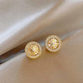 Pair of copper eight-pointed star stud earrings with real gold plating and inlaid zircon