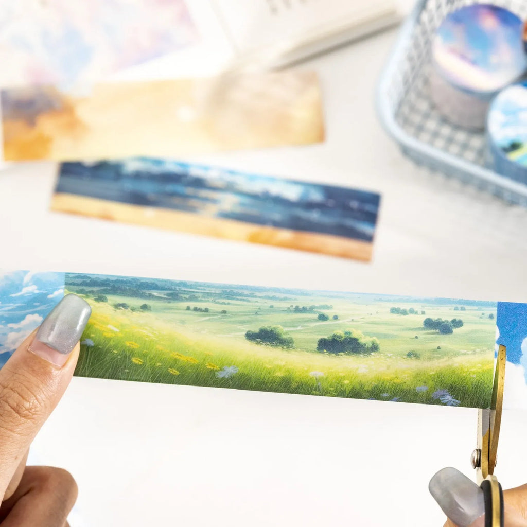 Japanese paper decorative tape roll with sky patterns including clouds, twilight and nebula designs