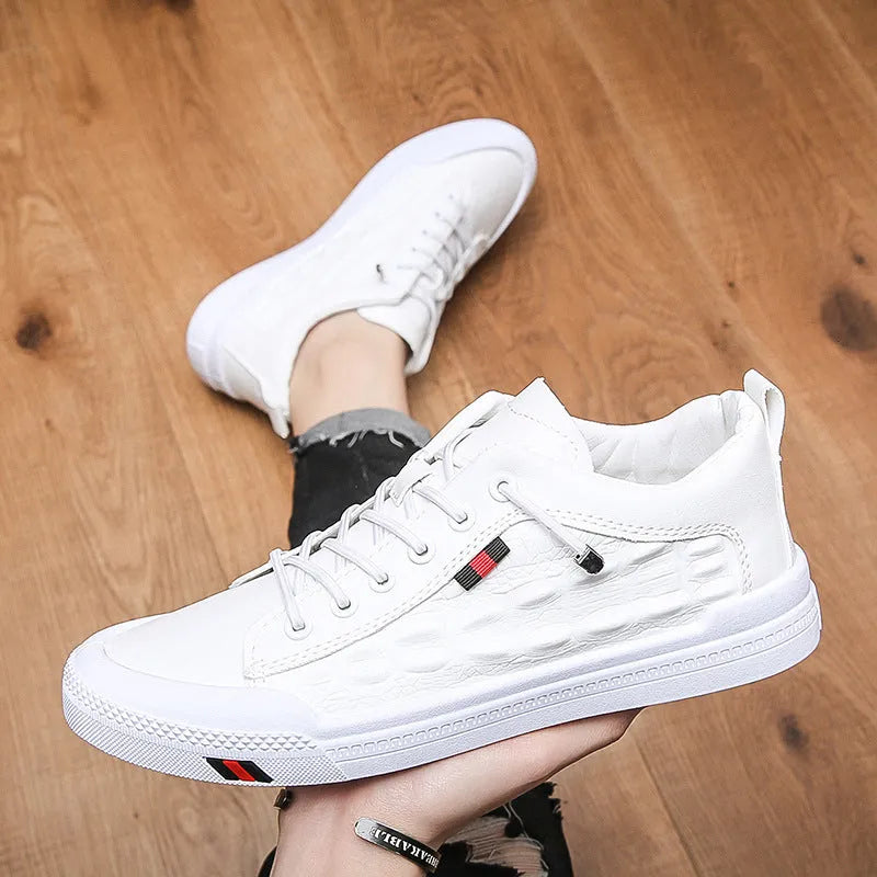 Men's white lace-up casual sneakers with round toe and flat rubber sole.