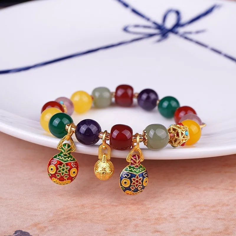 Hand-woven agate bracelet with Swallowing Gold Beast design on 10mm beads