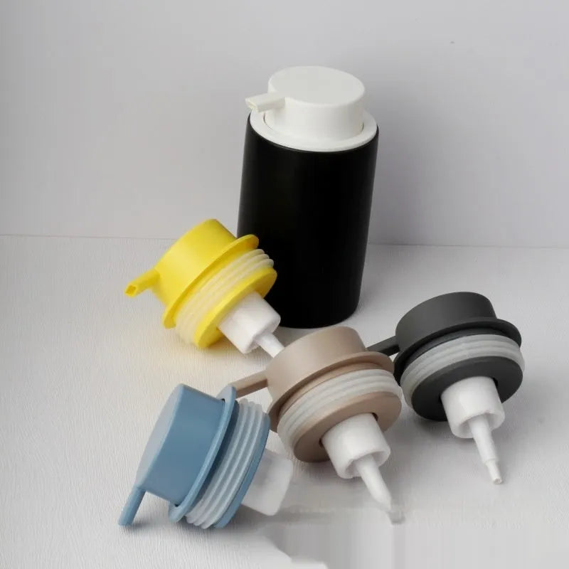 Foam pump facial cleanser dispenser with hand push mechanism in metallic finish