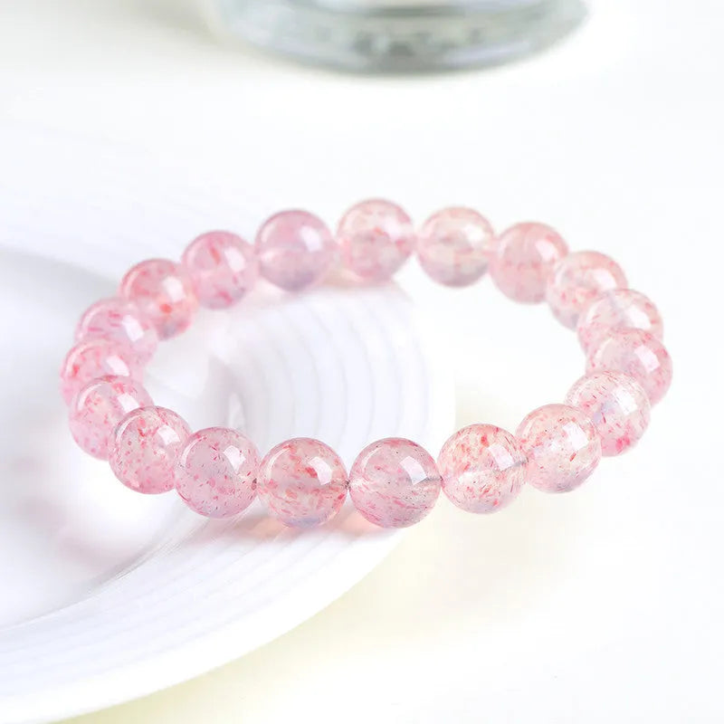 Strawberry quartz crystal bracelet with 10-10.8mm geometric beads in natural white water colour