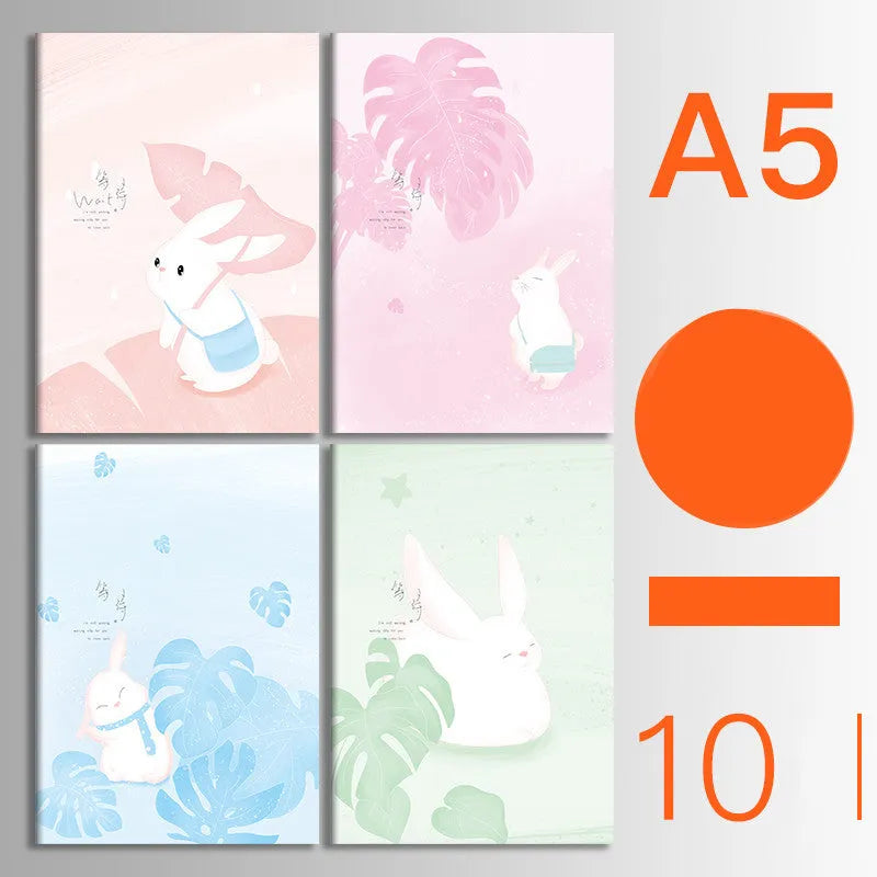Set of 10 kraft paper notebooks with various hand-painted covers, shown open to display thread binding.